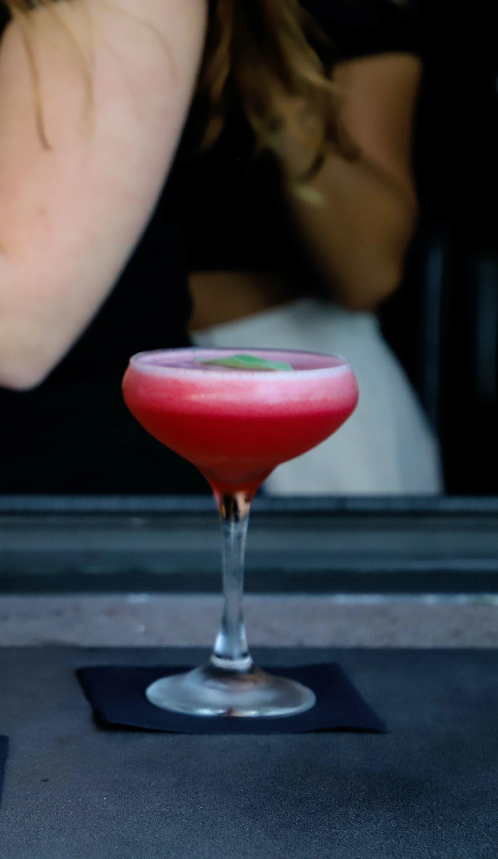 Red Cocktail Served in a Coup Inside Mia Kitchen & Bar